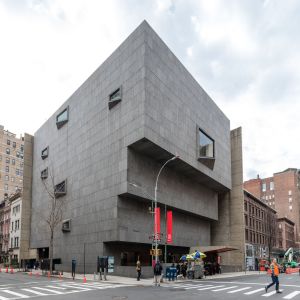 a group of people walking in front of Whitney Museum of American Art