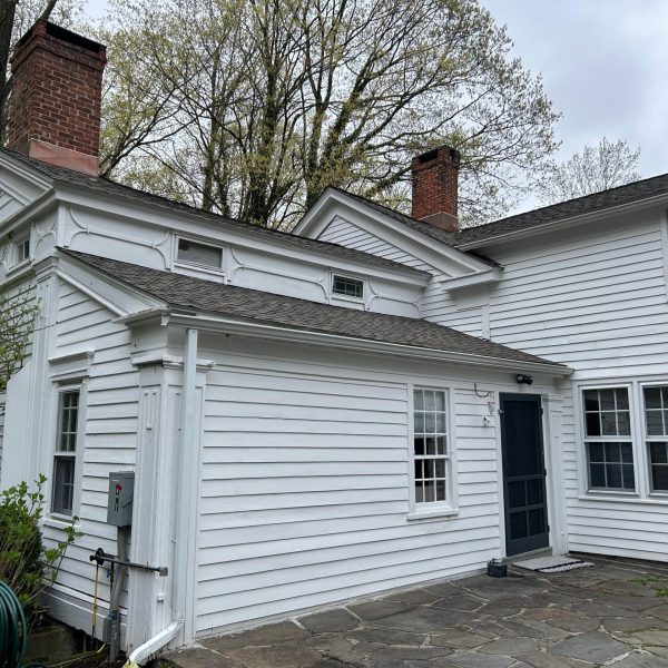 a bench in front of a brick building