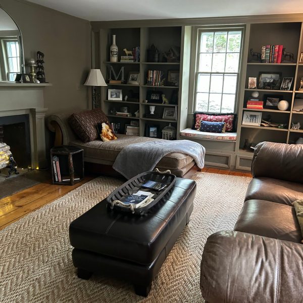 a living room filled with furniture and a large window