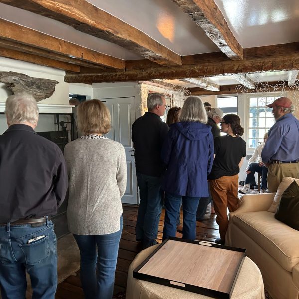 a group of people standing in a room