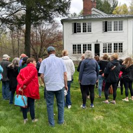 a group of people standing in a field