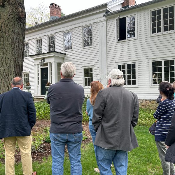 a group of people standing in front of a building