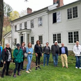 a group of people standing in front of a building