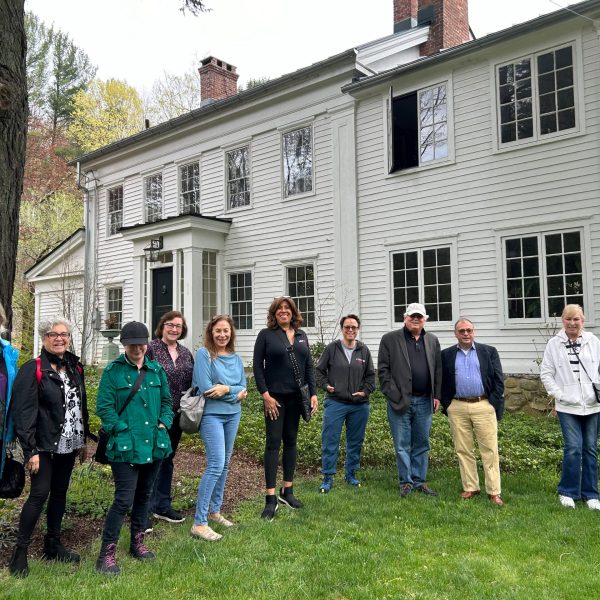 a group of people standing in front of a building