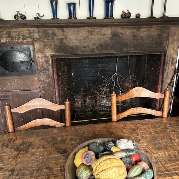 a living room filled with furniture and a fire place sitting in a chair