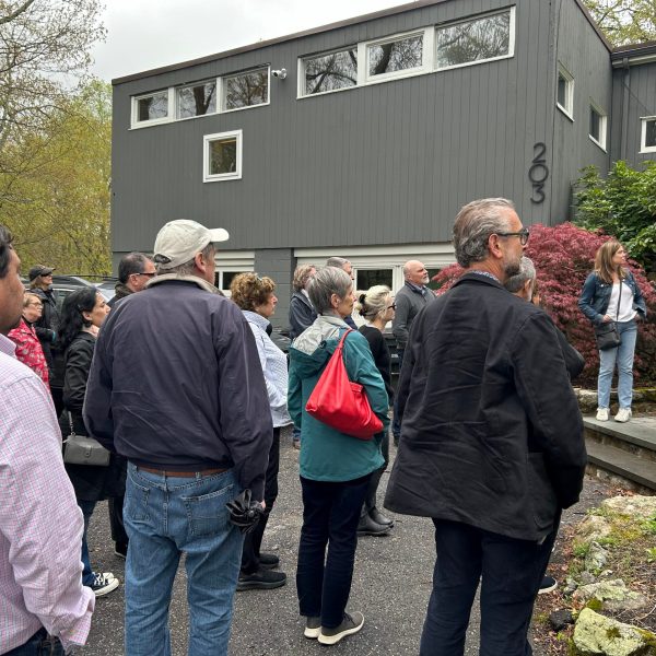a group of people standing in front of a crowd