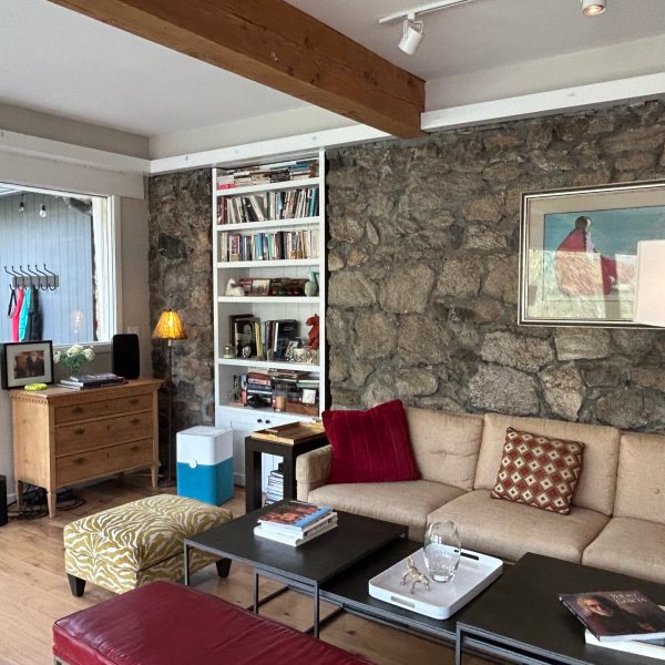 a living room filled with furniture and a fire place