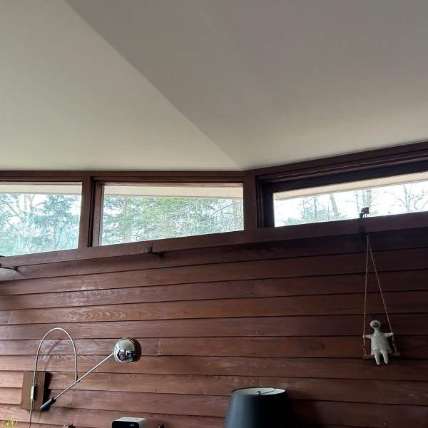 a man standing in front of a window