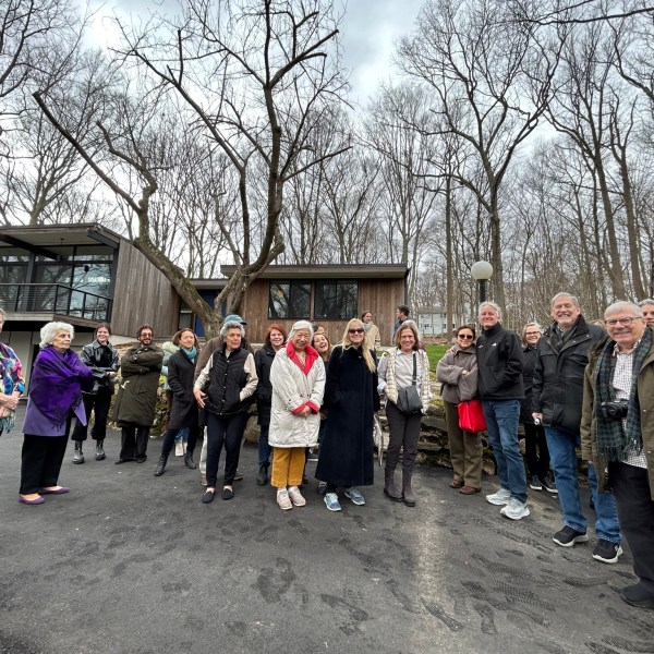 a group of people walking down a road
