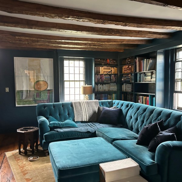 a living room filled with furniture and a large window