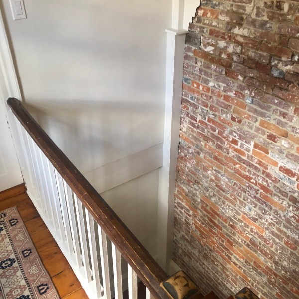 a room with a brick wall