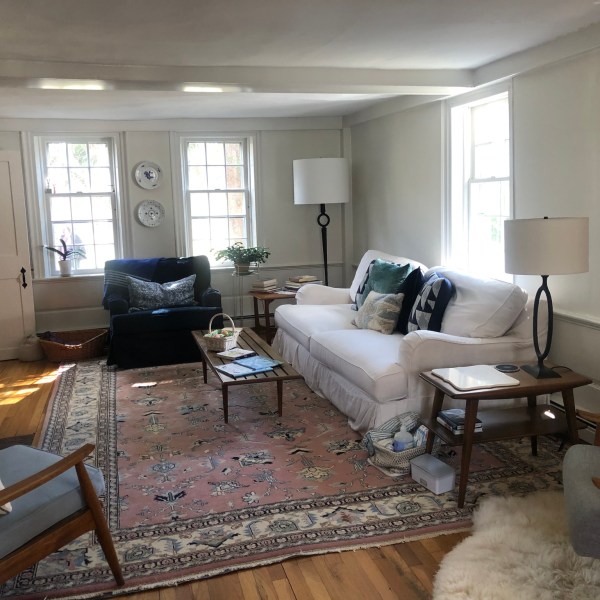 a living room filled with furniture and a fireplace