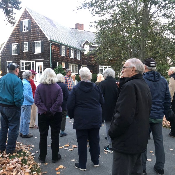 a group of people standing in front of a crowd
