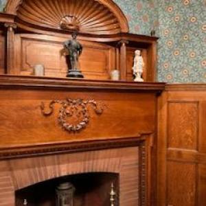 a kitchen with wooden cabinets and a fireplace