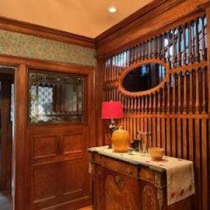 a kitchen with wooden cabinets and a window