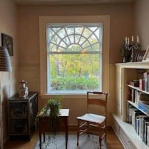 a room filled with furniture and a book shelf
