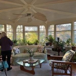 a living room filled with furniture and a large window