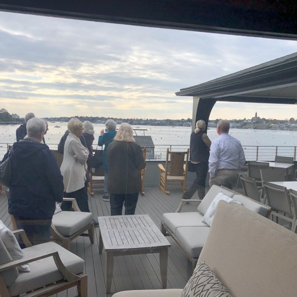 a group of people standing on a bridge