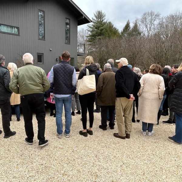 a group of people standing in front of a crowd
