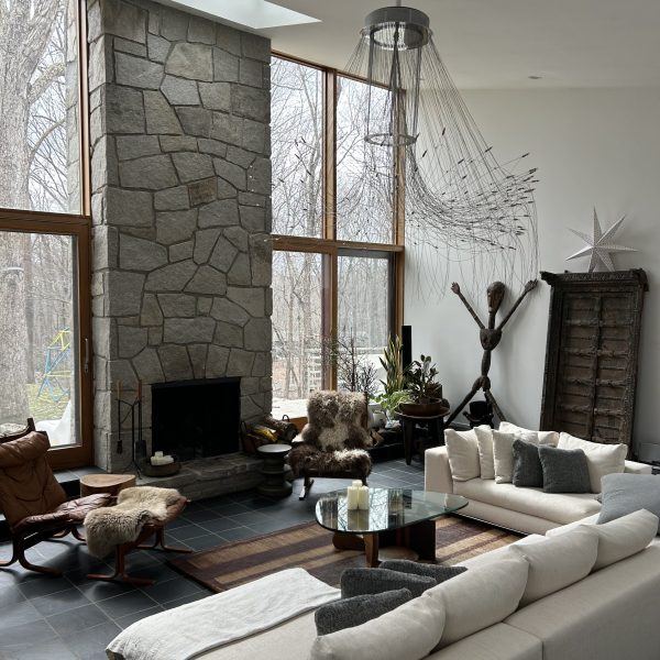 a living room with a fireplace and a large window