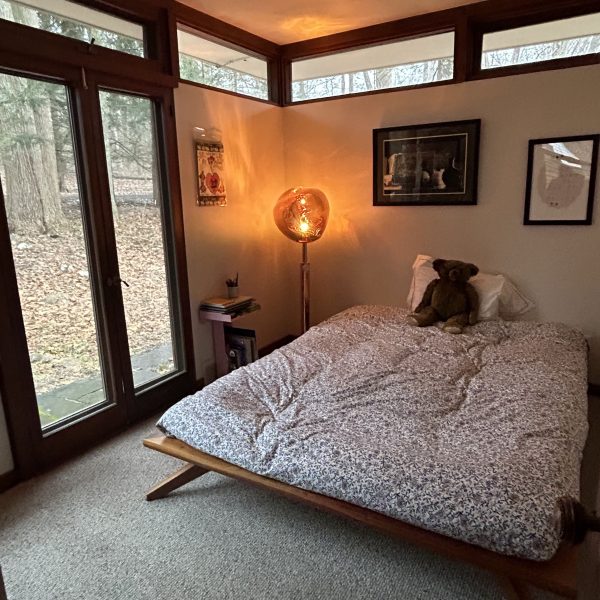 a bedroom with a bed and a window