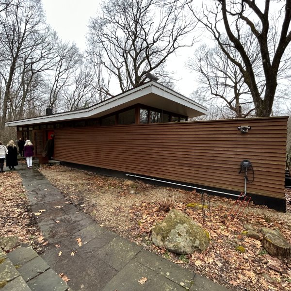 a path with trees on the side of a building