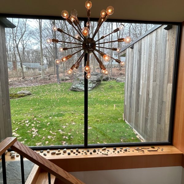 a vase of flowers sitting on top of a wooden table