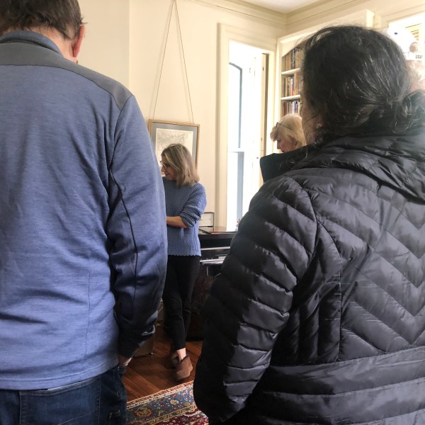 a man standing in front of a window