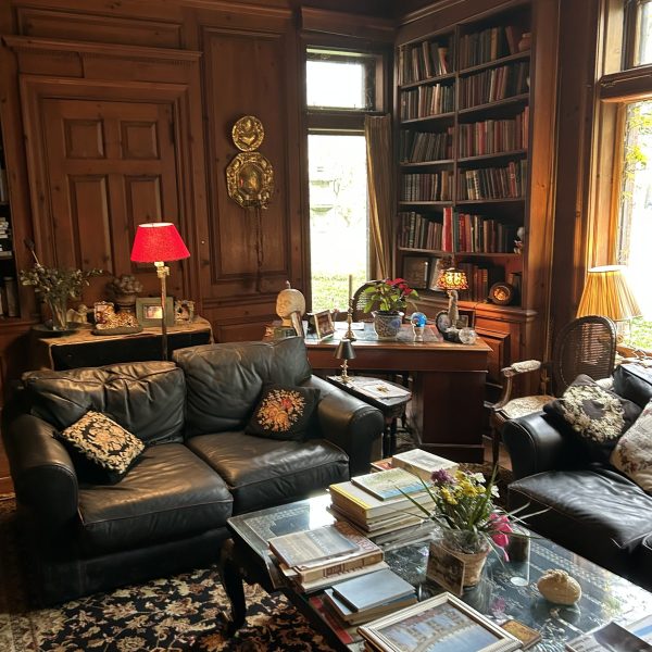 a living room filled with furniture and a large window