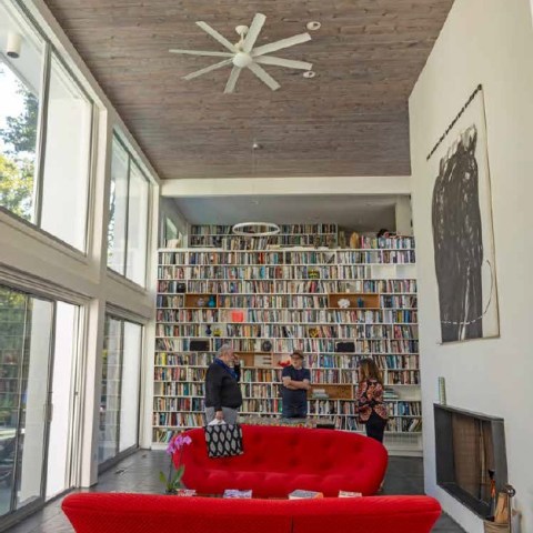 a living room filled with furniture and a large window