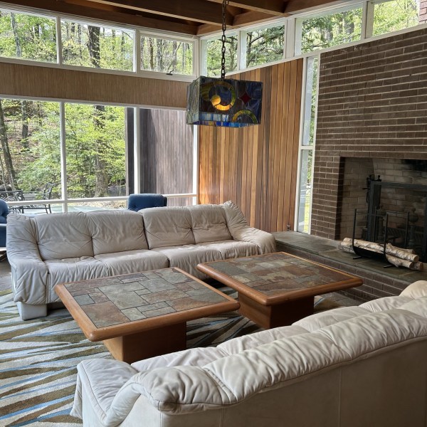 a bench next to a fireplace