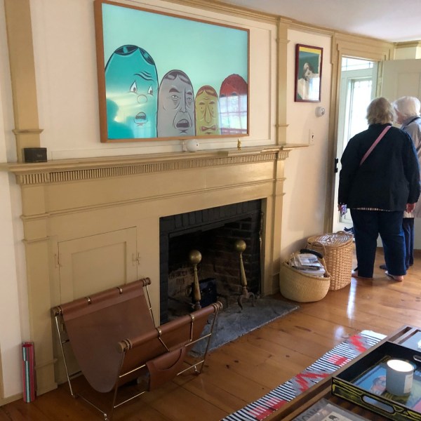 a person standing in front of a television