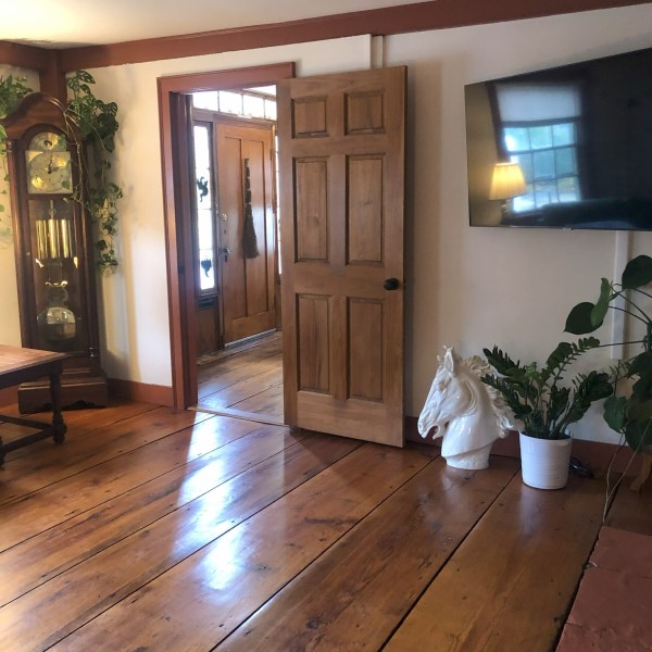 a view of a living room filled with furniture and a fireplace