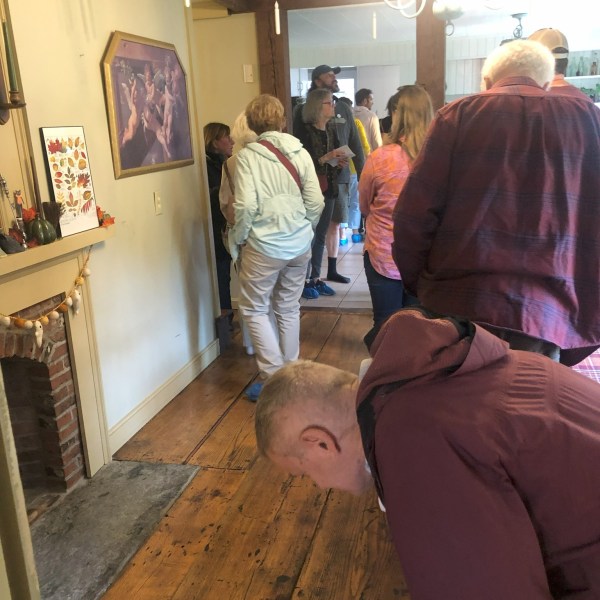 a group of people standing in a room
