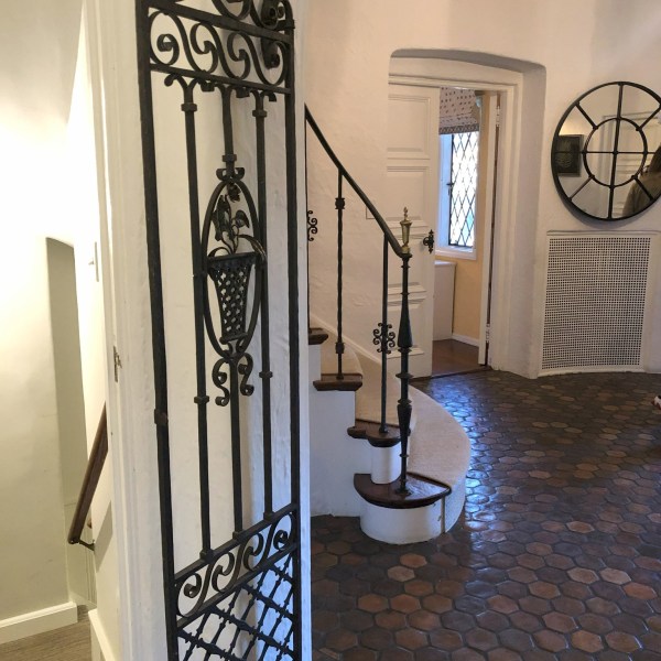 a clock hanging off the side of a building