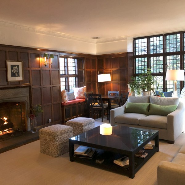 a living room filled with furniture and a large window