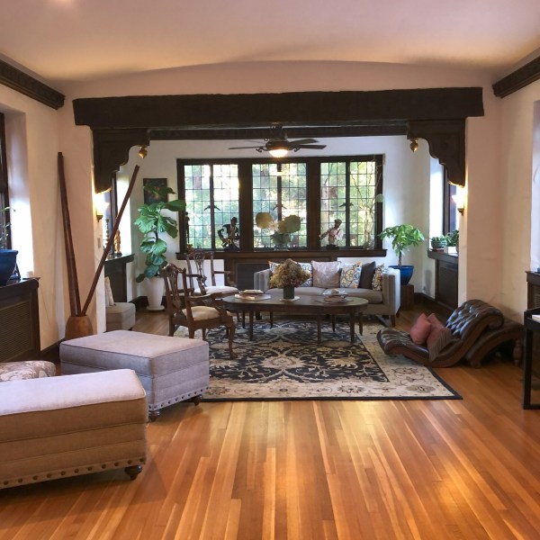 a living room filled with furniture and a large window