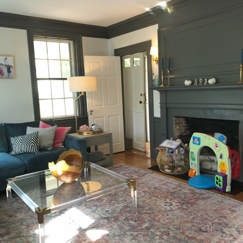 a living room filled with furniture and a large window