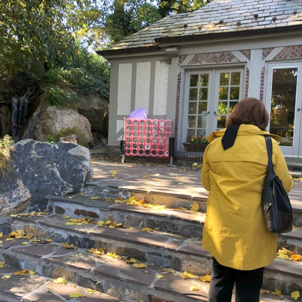 a group of people standing outside of a building