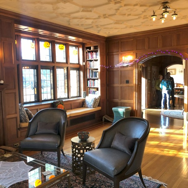 a living room filled with furniture and a large window