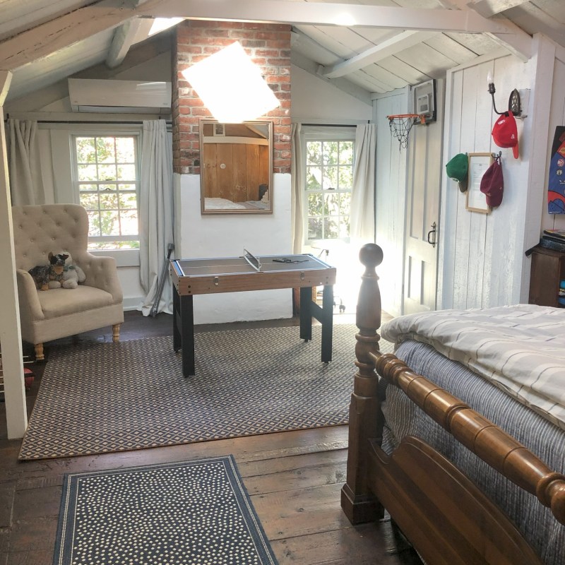 a bedroom with a large bed in a room