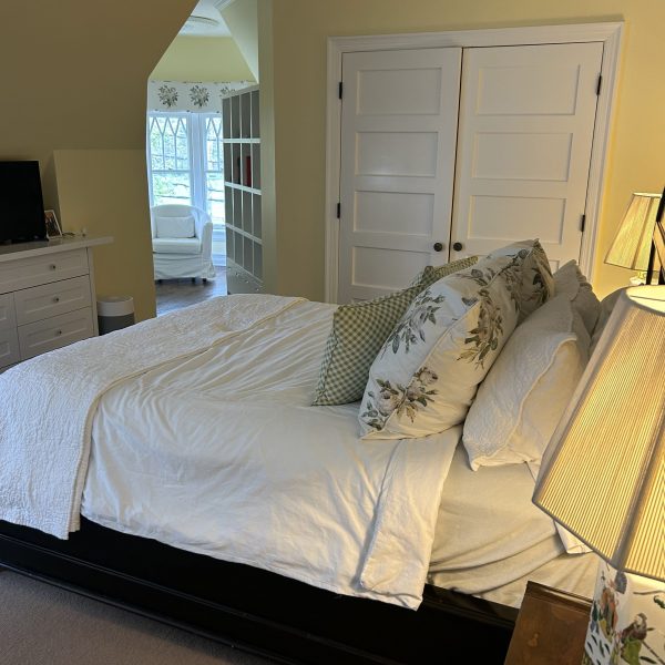 a bedroom with a bed in a room