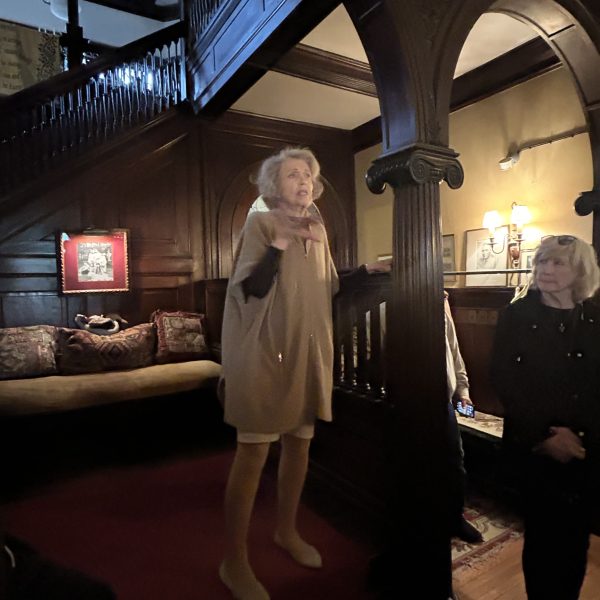 a man standing in front of a building