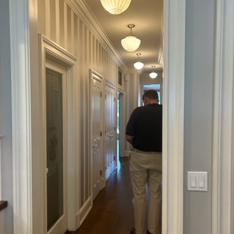 a man standing in front of a mirror