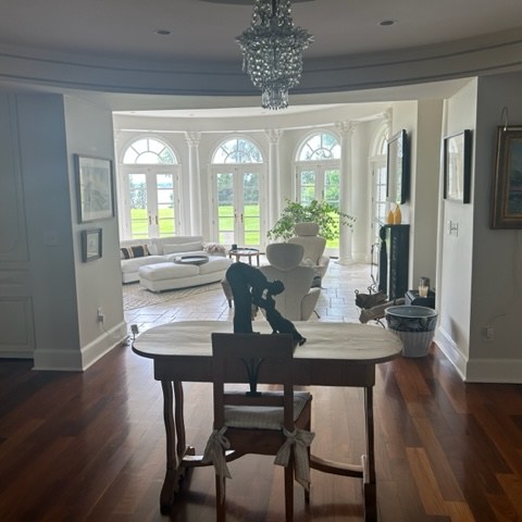a living room filled with furniture and a large window