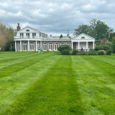 a house with a green field