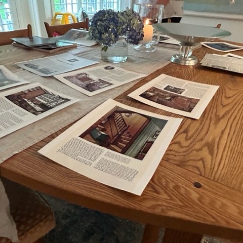 a laptop computer sitting on top of a wooden table