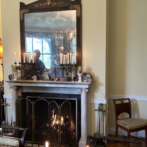 a room with a fireplace and a large window
