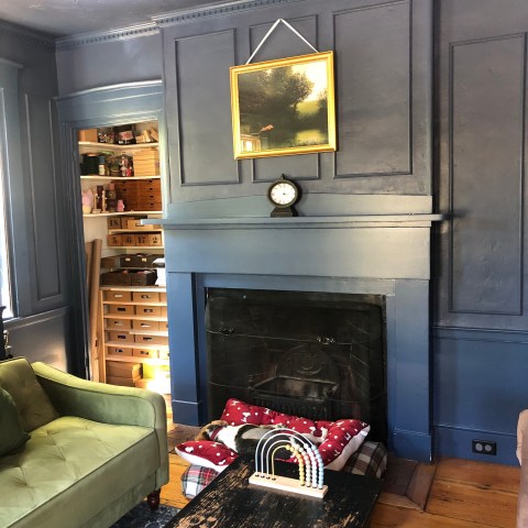 a living room filled with furniture and a fireplace
