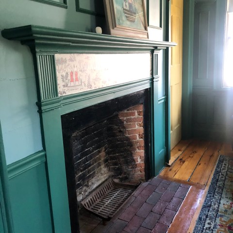 a door is open to a brick wall